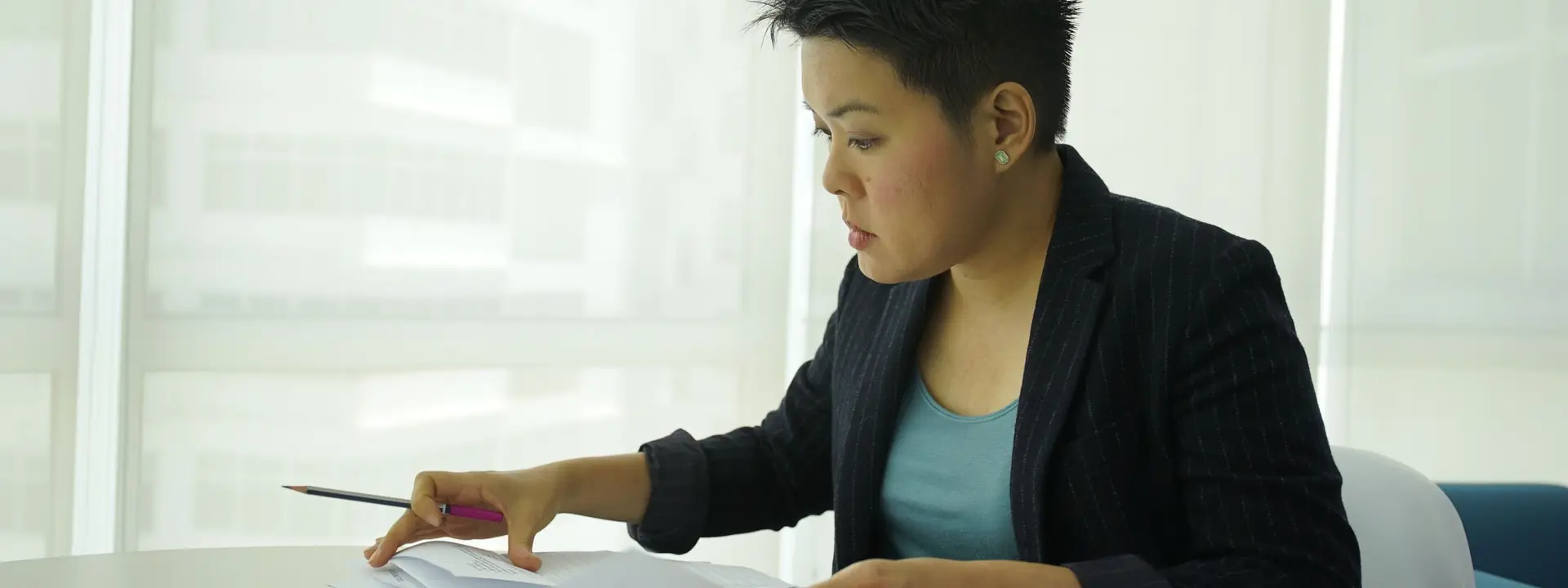 Back office support specialist processing client documents and data entry queues