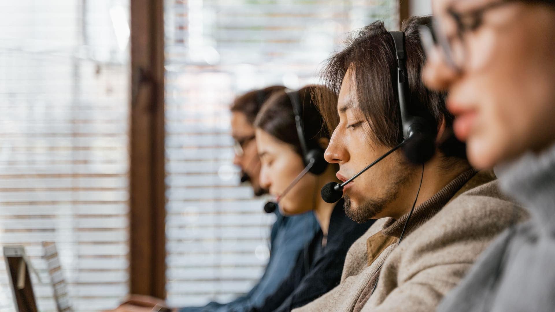 Rows of CrossShore agents working the floor of a large call center delivery centre in India