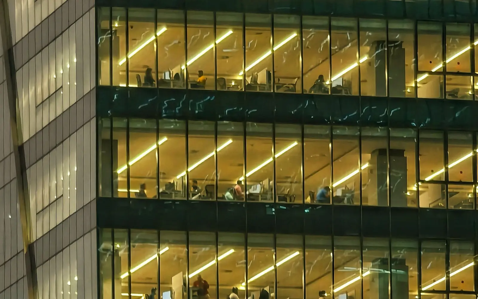 CrossShore delivery centre building lit through the night as multi-shift outsourced teams work overseas client hours