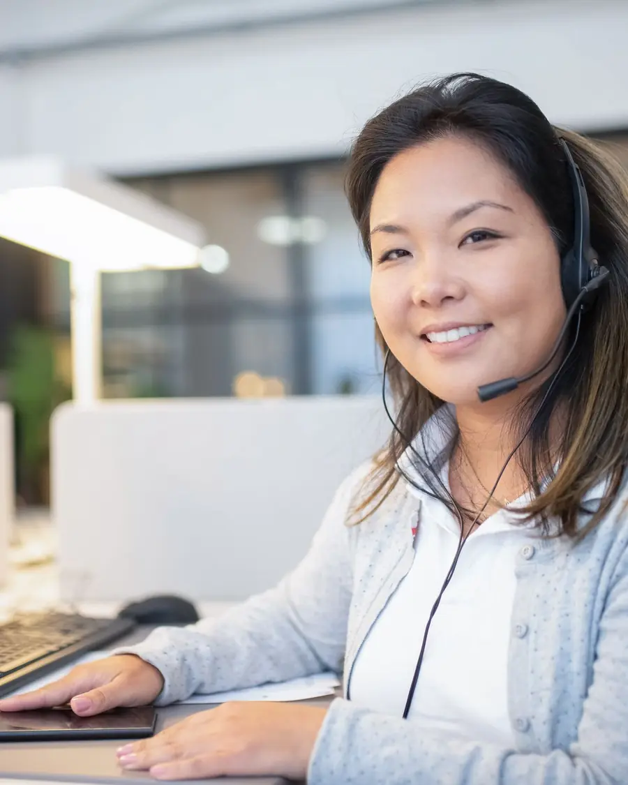 Quality assurance analyst scoring recorded calls against a client quality rubric
