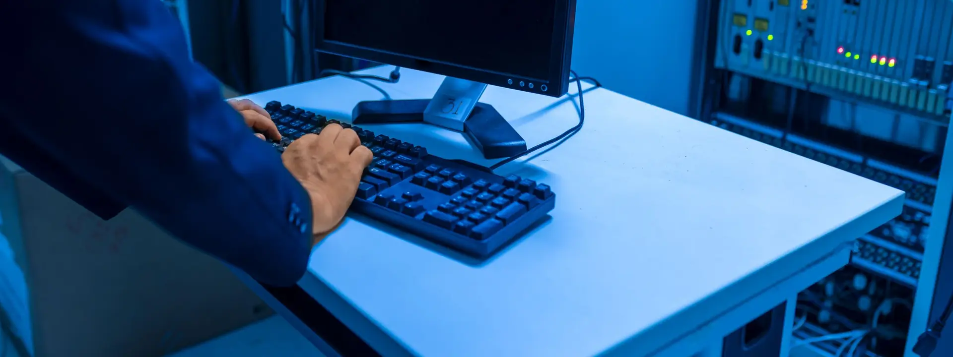 Managed IT services engineer monitoring infrastructure from a network operations centre