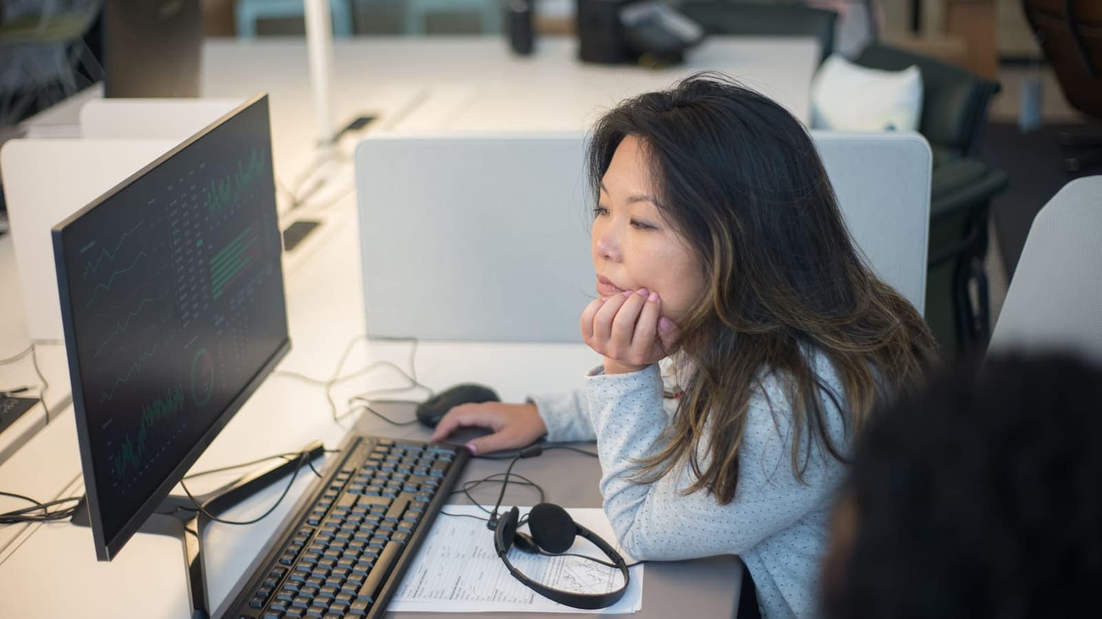 CrossShore technical support engineers running L1 and L2 IT help desk troubleshooting at multi-monitor workstations